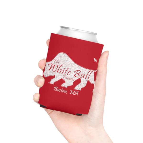 Hand holding a red can koozie with The White Bull Tavern logo and "Boston, MA".